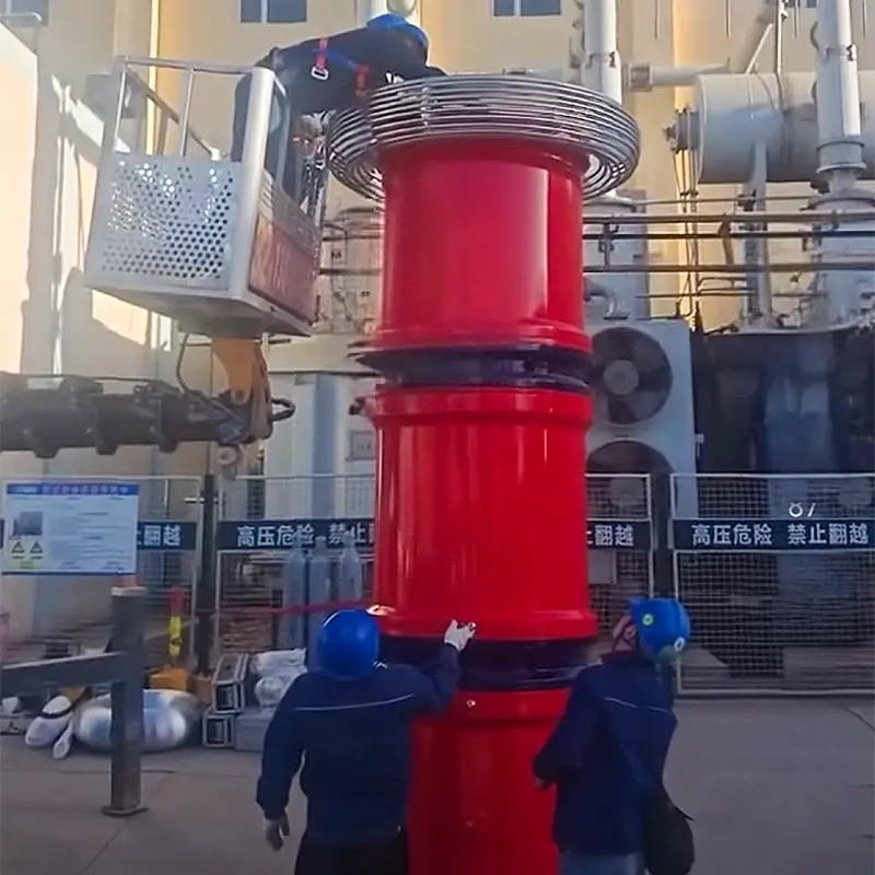 Workers using a boom lift to assemble the high voltage reactor of the AC Resonant Test System.