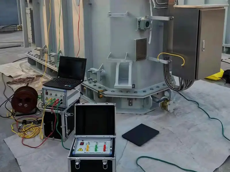 SFRA test equipment connected to a power transformer for on-site testing.